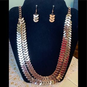 Gold necklace with matching pierced earrings.
